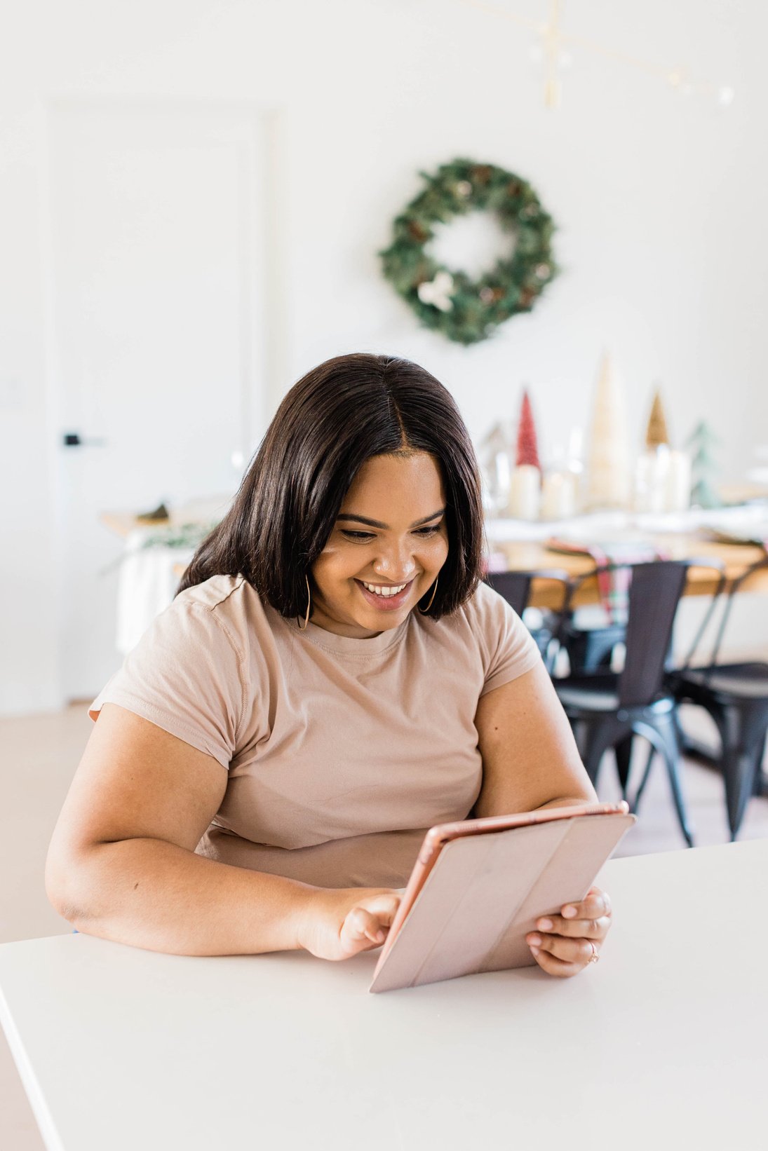 Happy Woman Using Digital Tablet at Home