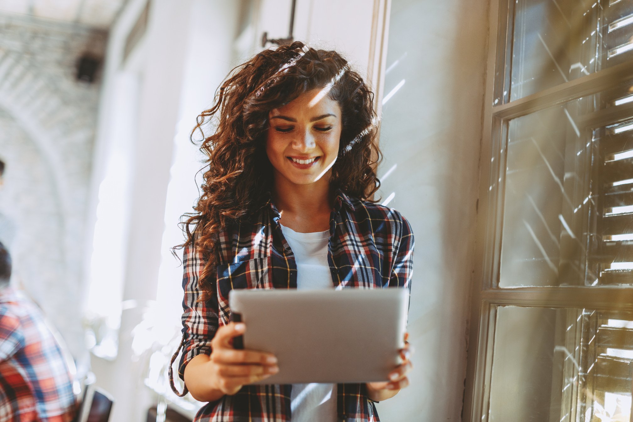 Young student woman online via digital tablet